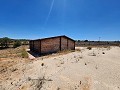 27,000m2 of land with wooden cabin in Spanish Fincas